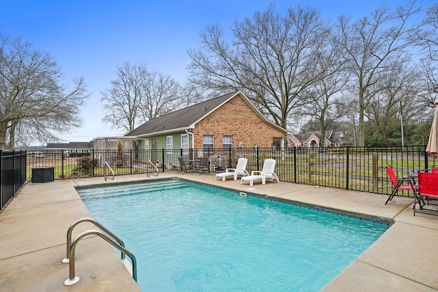 view of pool featuring a patio, fence, and a fenced in pool