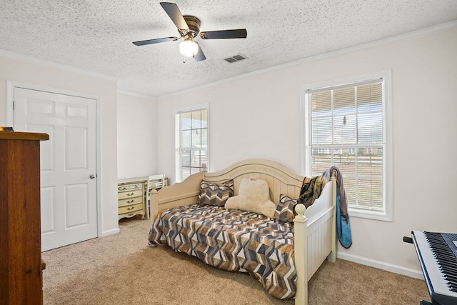 bedroom featuring light carpet, visible vents, a textured ceiling, and ornamental molding