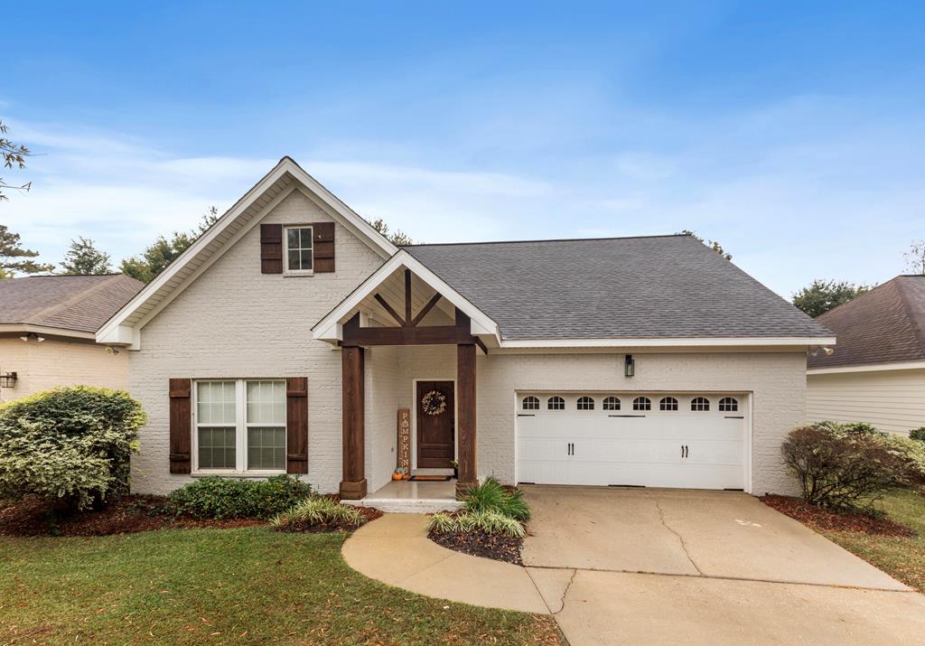 view of front of property with a garage and a front yard