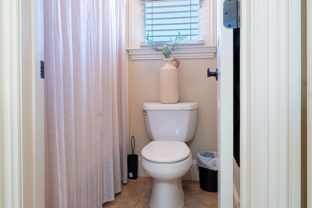 bathroom with tile patterned floors and toilet