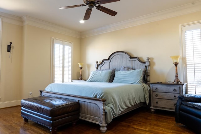 bedroom featuring ceiling fan, dark hardwood / wood-style flooring, and multiple windows