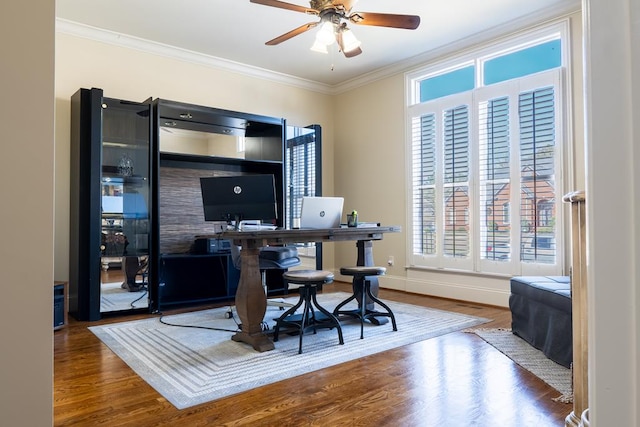 office area featuring ceiling fan, hardwood / wood-style floors, and ornamental molding