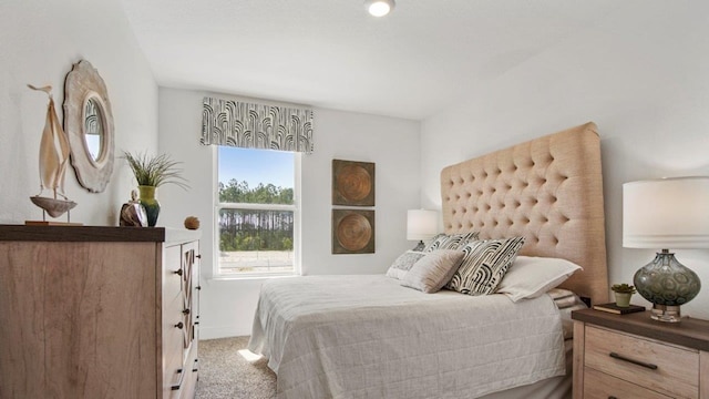 carpeted bedroom with baseboards