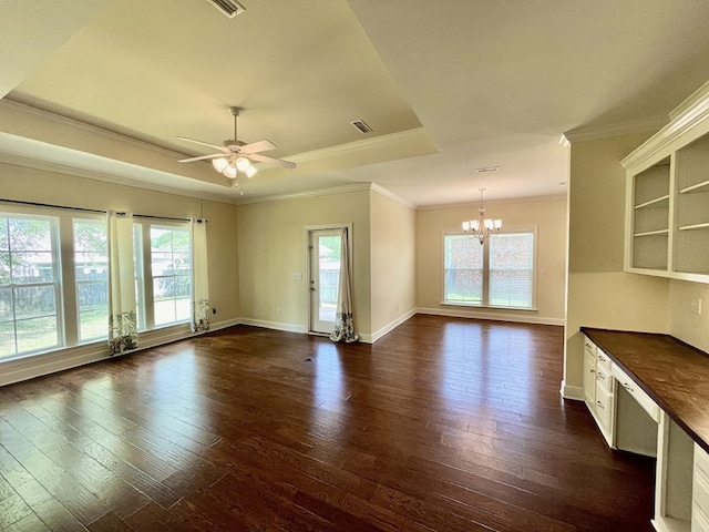 114 Brattleboro Ct, Dothan, AL 36301 - unfurnished living room with healthy amount of natural light, a chandelier, crown molding, dark wood-style flooring, and a raised ceiling