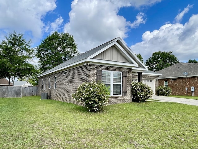 114 Brattleboro Ct, Dothan, AL 36301 - view of property exterior featuring brick siding, a garage, central AC, driveway, and board and batten siding