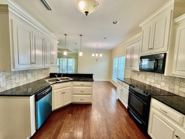 114 Brattleboro Ct, Dothan, AL 36301 - kitchen with black appliances, dark wood finished floors, a sink, a peninsula, and dark countertops