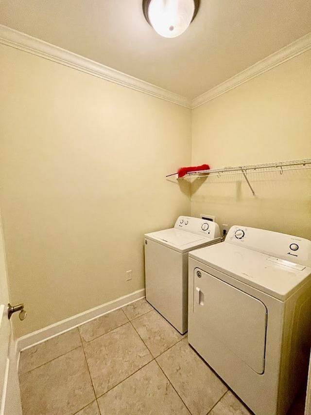 114 Brattleboro Ct, Dothan, AL 36301 - laundry area with crown molding, separate washer and dryer, baseboards, and light tile patterned floors