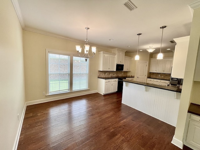114 Brattleboro Ct, Dothan, AL 36301 - kitchen with dark countertops, decorative backsplash, dark wood-style flooring, a peninsula, and ornamental molding
