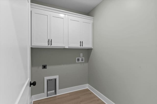 195 County Road 711, Enterprise, AL 36330 - laundry area featuring hookup for an electric dryer, light wood-style flooring, cabinet space, baseboards, and washer hookup