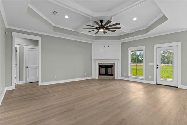 195 County Road 711, Enterprise, AL 36330 - unfurnished living room with coffered ceiling, ceiling fan, light wood-type flooring, crown molding, and a brick fireplace