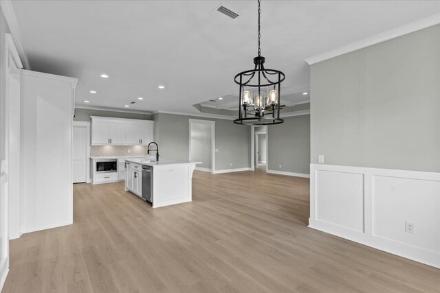 195 County Road 711, Enterprise, AL 36330 - kitchen with ornamental molding, dishwasher, light countertops, a chandelier, and open floor plan