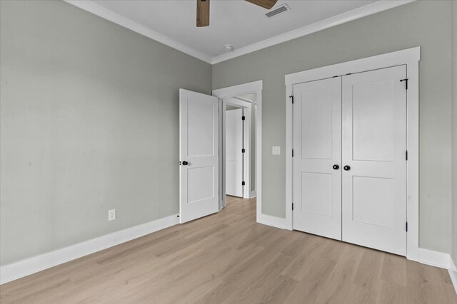 195 County Road 711, Enterprise, AL 36330 - unfurnished bedroom with light wood-type flooring, ornamental molding, a closet, baseboards, and a ceiling fan