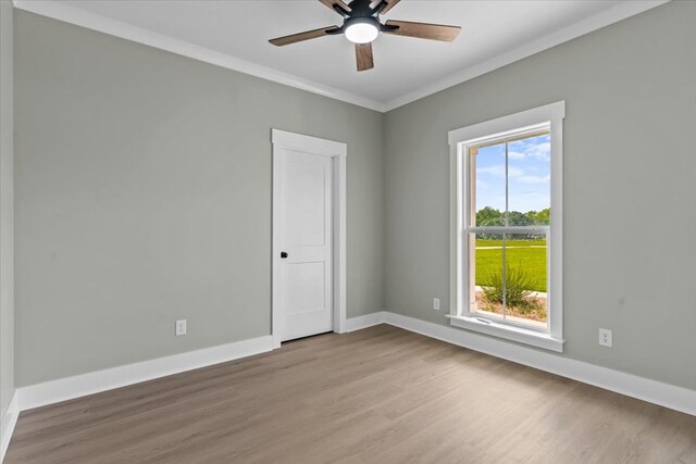 195 County Road 711, Enterprise, AL 36330 - unfurnished room featuring wood finished floors, a ceiling fan, baseboards, and crown molding