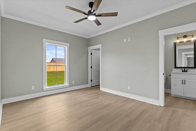 195 County Road 711, Enterprise, AL 36330 - unfurnished bedroom with a sink, light wood-style floors, crown molding, baseboards, and a ceiling fan