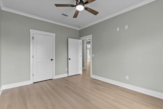 195 County Road 711, Enterprise, AL 36330 - unfurnished bedroom with light wood-style flooring, baseboards, crown molding, and ceiling fan