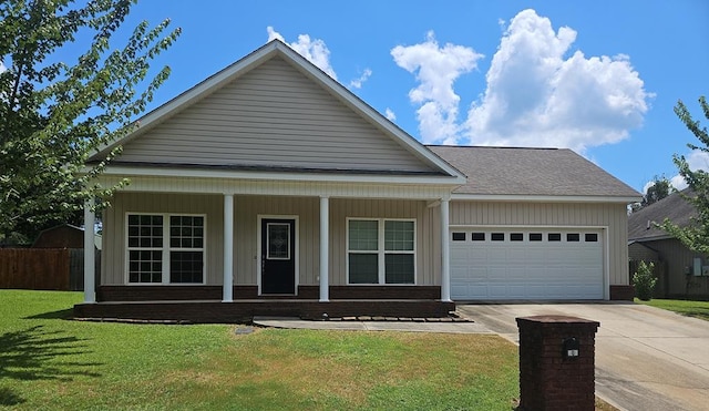 103 Whaley Ct, Ashford, AL 36312 - view of front facade with an attached garage, concrete driveway, a porch, brick siding, and board and batten siding