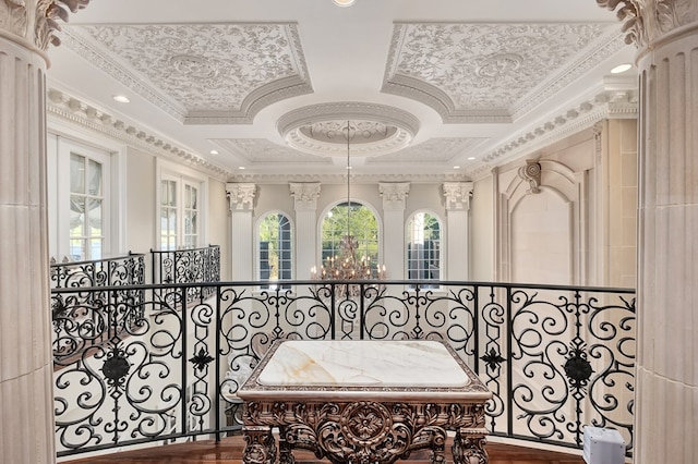 hallway featuring wood-type flooring, crown molding, and coffered ceiling