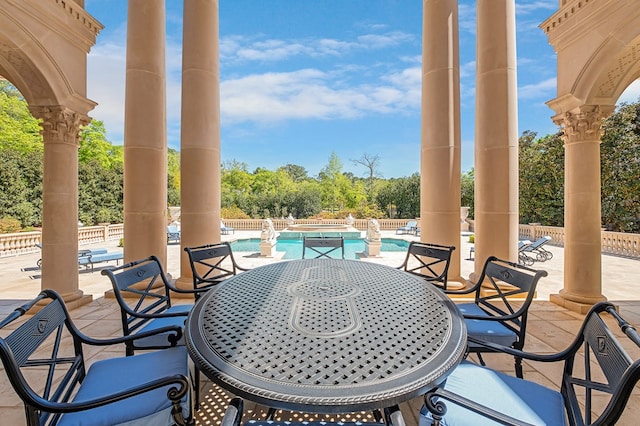 view of patio featuring a community pool