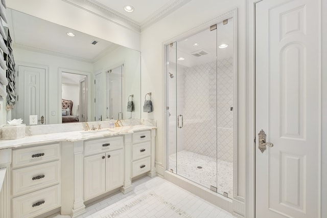 bathroom with tile patterned flooring, vanity, a shower with door, and crown molding