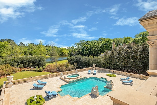 view of pool with a water view, an in ground hot tub, and a patio