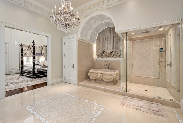 bathroom featuring ornamental molding, shower with separate bathtub, and an inviting chandelier