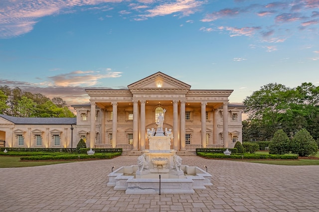 view of outdoor building at dusk