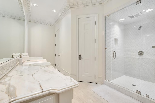 bathroom featuring vanity and an enclosed shower