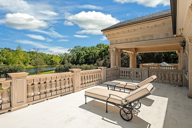 view of patio with a water view