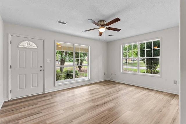 618 Langley Dr, Dothan, AL 36301 - entrance foyer featuring ceiling fan, light wood-style flooring, baseboards, and a textured ceiling
