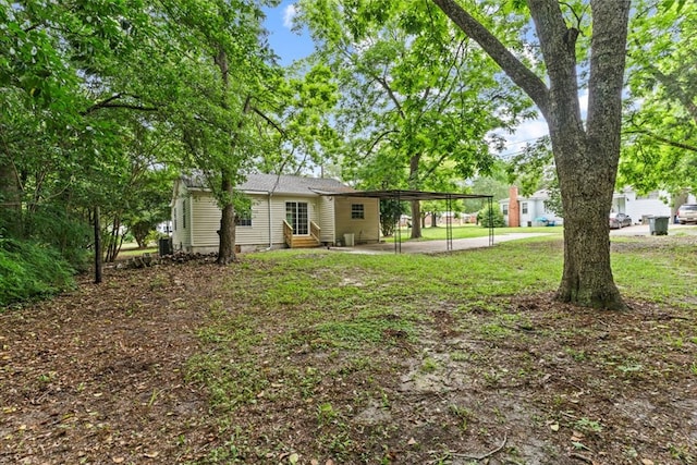 618 Langley Dr, Dothan, AL 36301 - view of green lawn featuring entry steps, an attached carport, and concrete driveway