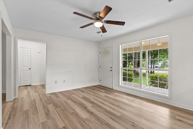 618 Langley Dr, Dothan, AL 36301 - empty room featuring light wood-style flooring, ceiling fan, and baseboards