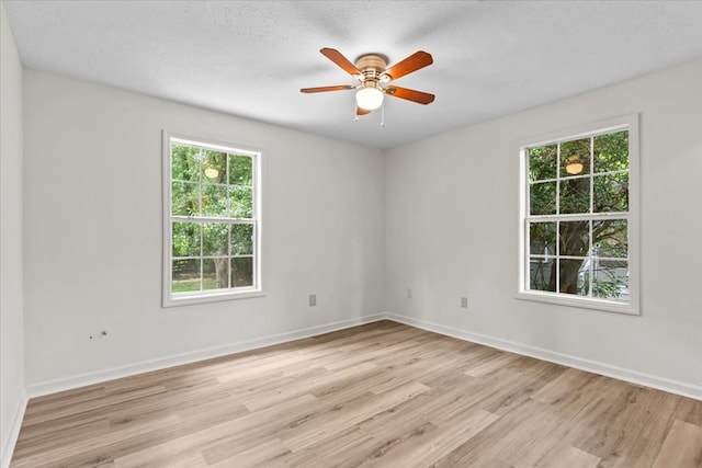 618 Langley Dr, Dothan, AL 36301 - unfurnished room with healthy amount of natural light, light wood-style floors, ceiling fan, baseboards, and a textured ceiling