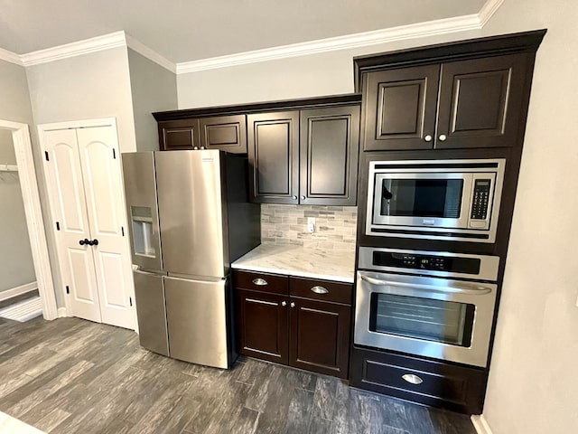 kitchen with dark brown cabinetry, decorative backsplash, appliances with stainless steel finishes, and ornamental molding