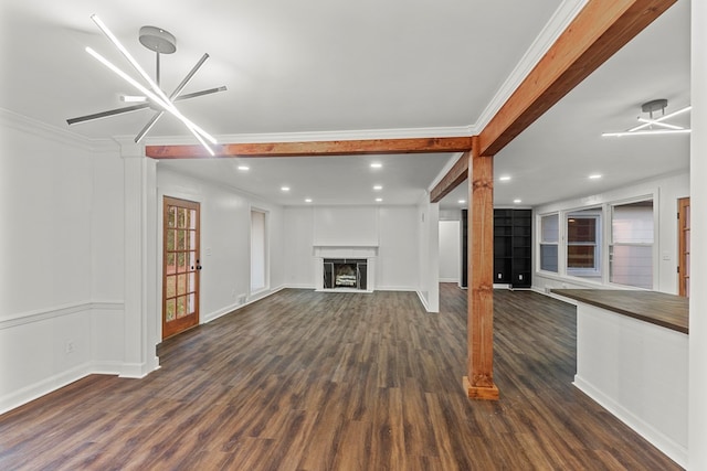 unfurnished living room with ornamental molding, an inviting chandelier, dark wood-type flooring, and beam ceiling