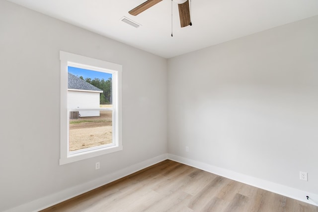 unfurnished room featuring light hardwood / wood-style flooring and ceiling fan