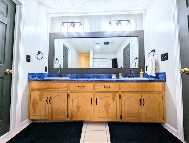 1370 Coach Rd, Slocomb, AL 36375 - bathroom with double vanity and tile patterned flooring