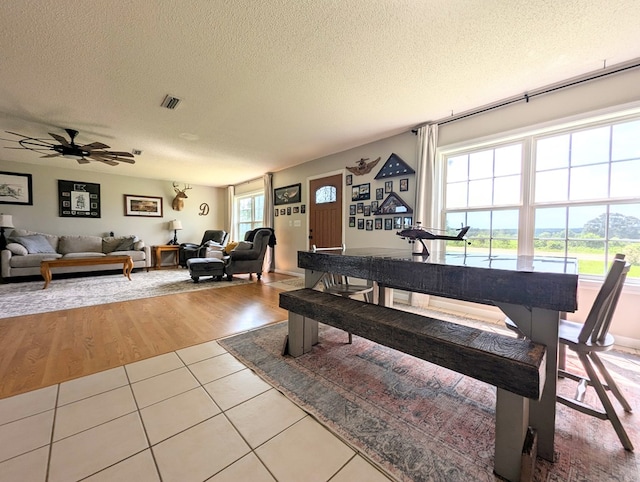 1370 Coach Rd, Slocomb, AL 36375 - tiled dining area featuring a textured ceiling and a ceiling fan