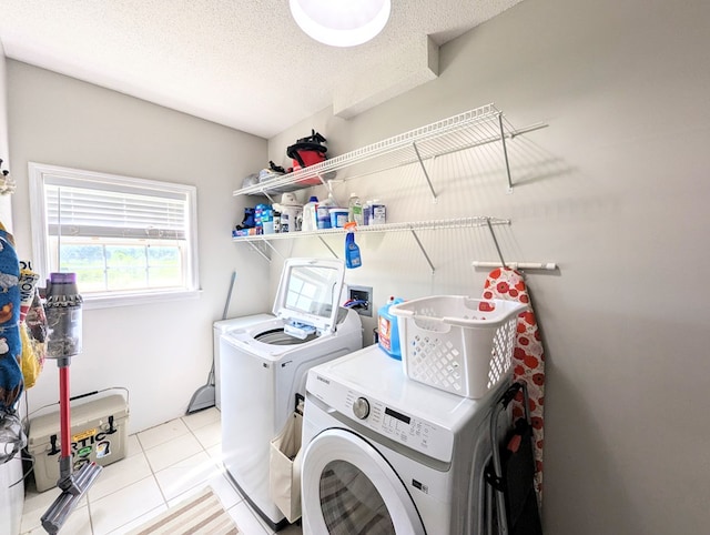 1370 Coach Rd, Slocomb, AL 36375 - washroom with washing machine and clothes dryer and light tile patterned flooring