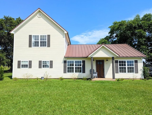 1370 Coach Rd, Slocomb, AL 36375 - view of front of home featuring a front yard and a metal roof