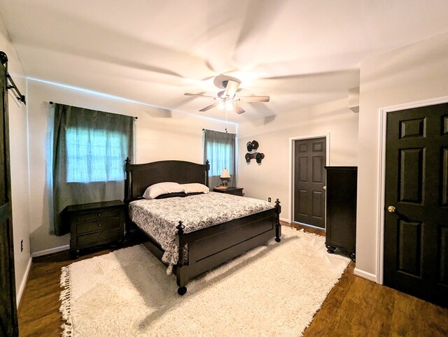 1370 Coach Rd, Slocomb, AL 36375 - bedroom featuring dark wood finished floors and ceiling fan