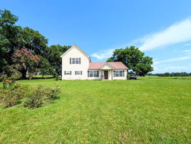 1370 Coach Rd, Slocomb, AL 36375 - view of front of house featuring a front lawn and a metal roof
