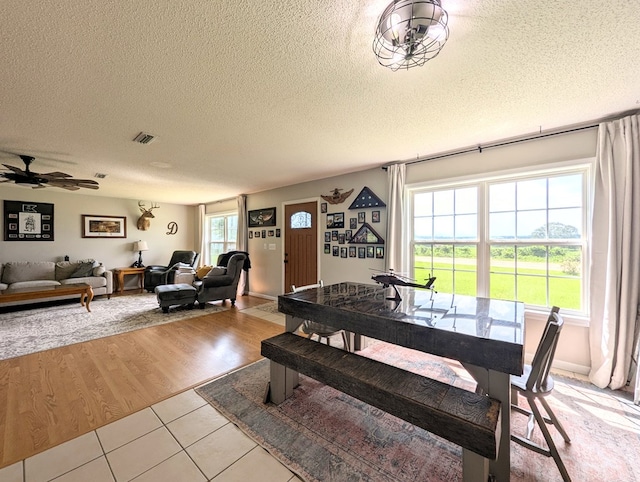 1370 Coach Rd, Slocomb, AL 36375 - dining space with a textured ceiling, light tile patterned floors, and a ceiling fan