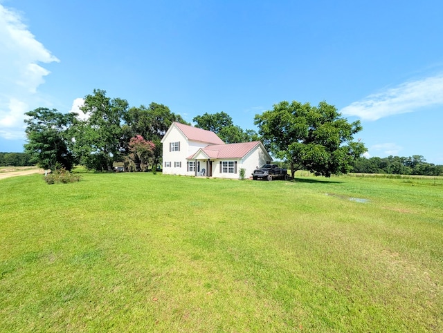 1370 Coach Rd, Slocomb, AL 36375 - view of front of house with a front yard and a metal roof