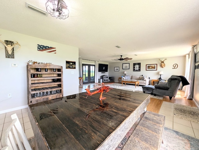 1370 Coach Rd, Slocomb, AL 36375 - tiled dining area with a textured ceiling and ceiling fan
