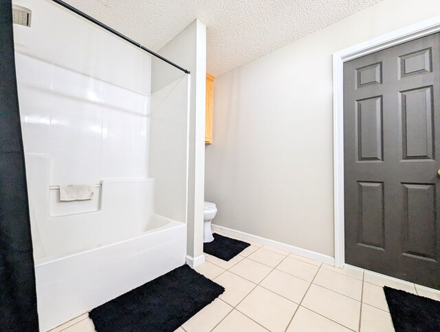 1370 Coach Rd, Slocomb, AL 36375 - bathroom with bathing tub / shower combination, tile patterned floors, and a textured ceiling