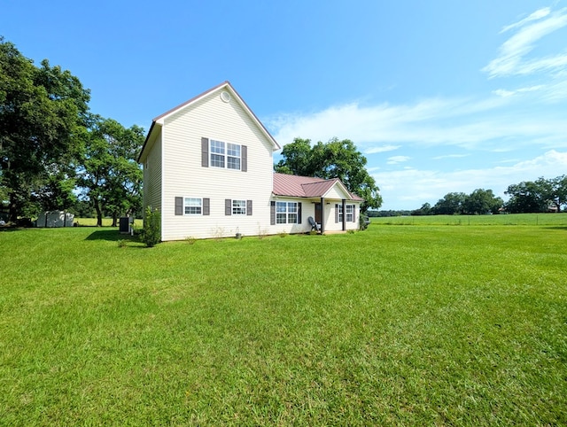 1370 Coach Rd, Slocomb, AL 36375 - rear view of property with a yard and a metal roof