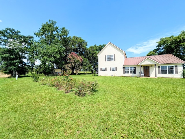 1370 Coach Rd, Slocomb, AL 36375 - view of front of home with a front yard and a metal roof