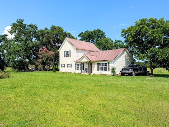 1370 Coach Rd, Slocomb, AL 36375 - traditional-style home featuring a front yard and a metal roof