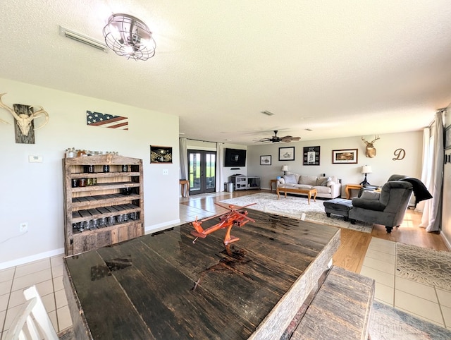 1370 Coach Rd, Slocomb, AL 36375 - dining space featuring a ceiling fan, a textured ceiling, and tile patterned flooring