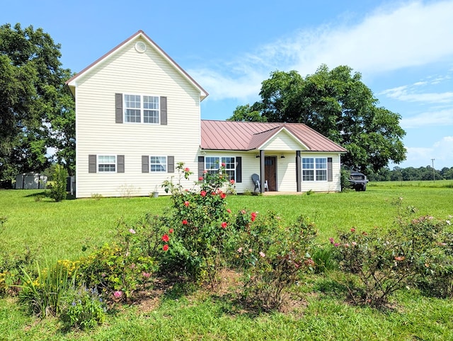 1370 Coach Rd, Slocomb, AL 36375 - view of front of home featuring a front yard and a metal roof